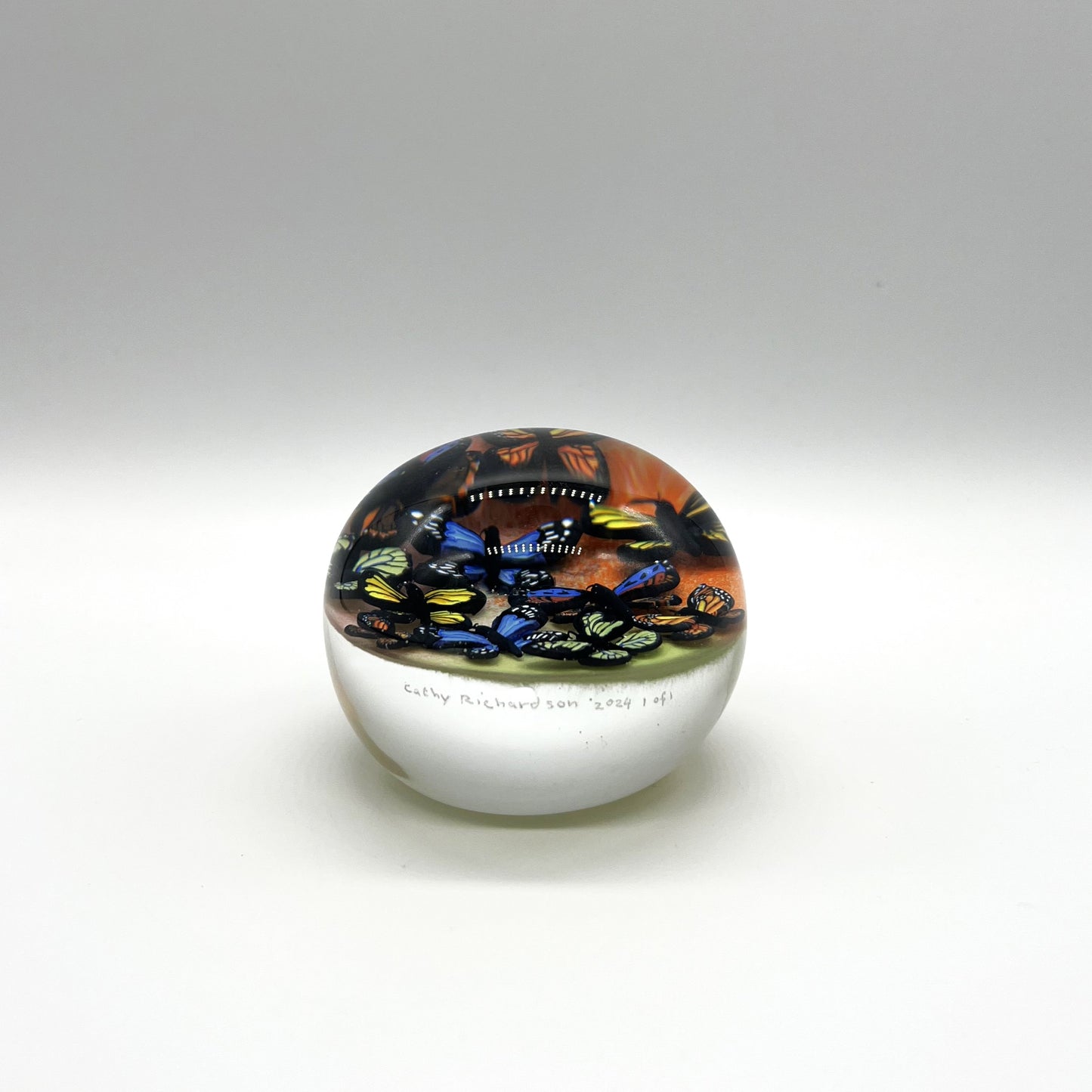 Butterfly Cloud on Orange & Yellow Paperweight 2024 by Cathy Richardson